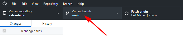 A red arrow points to the middle of the three tabs. It states that the current branch is 'main'.